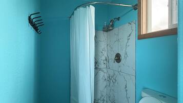 Shower, towels, soap, toilet paper