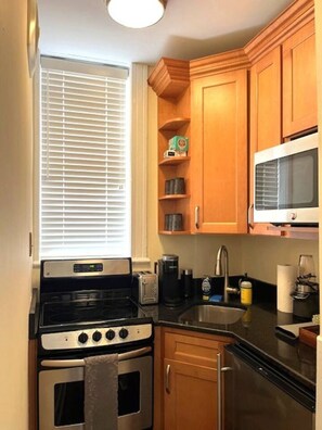 Microwave, coffee/tea maker, cookware/dishes/utensils