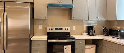 Fridge, microwave, stovetop, coffee/tea maker