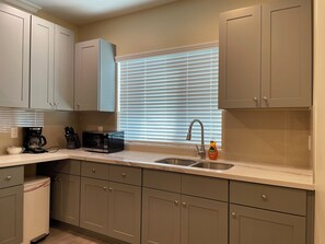 Fridge, microwave, stovetop, coffee/tea maker