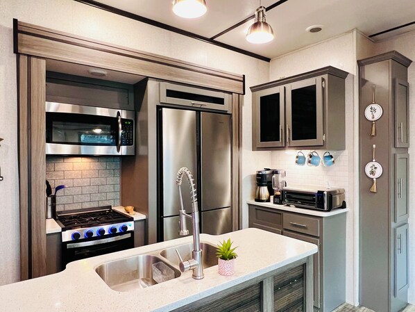 Fridge, microwave, oven, cookware/dishes/utensils