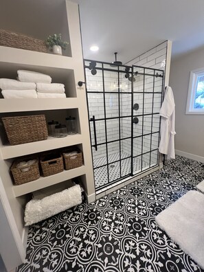 Shower, hair dryer, towels, soap