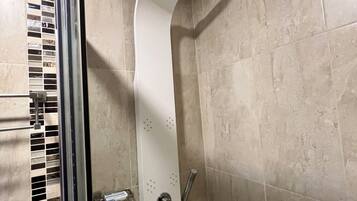 Jetted bath, hair dryer, towels, soap
