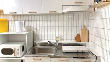 Fridge, coffee/tea maker, cookware/dishes/utensils