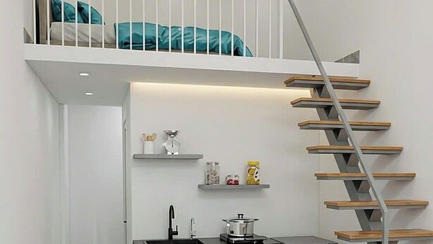 A compact kitchen with a built-in stove, a sink, and a compact refrigerator. - Mit homestay (Hue)