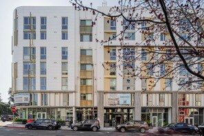 Stunning hotel with modern design, featuring spacious balconies and large windows.