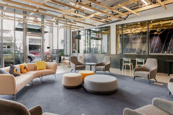 Relax in style with a sofa, armchairs, and ottomans, perfect for unwinding or socializing.