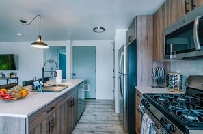 Fridge, microwave, dishwasher, cookware/dishes/utensils