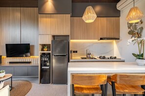 Fridge, microwave, stovetop, coffee/tea maker