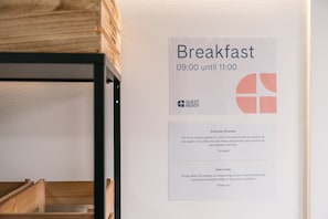 Enjoy breakfast at your chosen time, from 09:00 to 11:00, with a convenient sign guiding you to your table.