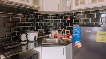 Fridge, microwave, cookware/dishes/utensils