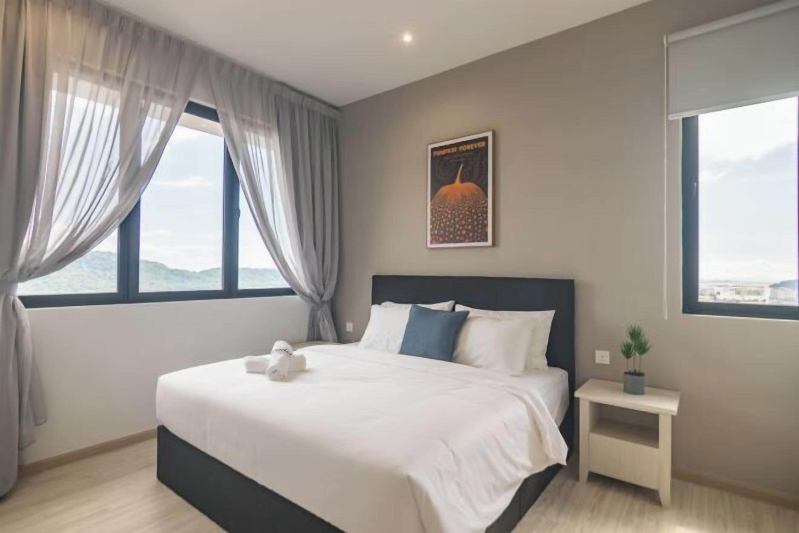 Premium bedding, desk, laptop workspace, blackout drapes