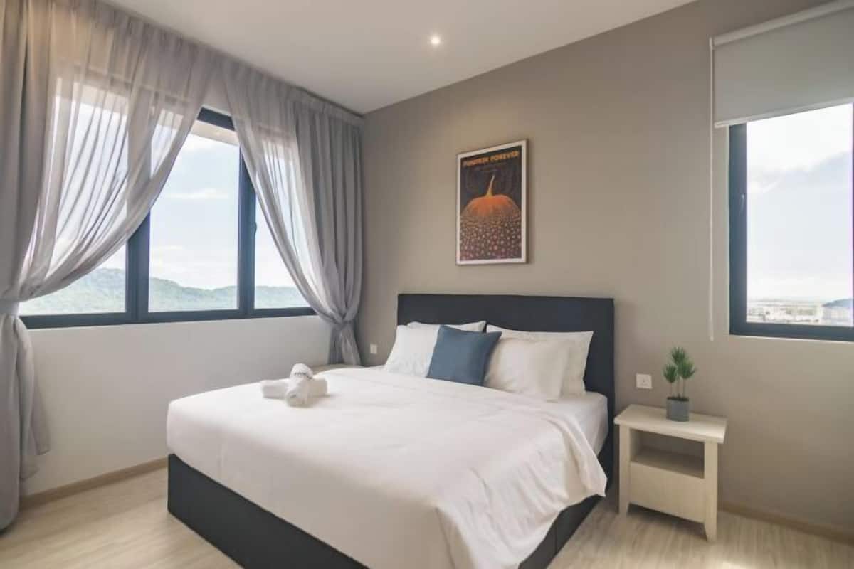 Premium bedding, desk, laptop workspace, blackout curtains