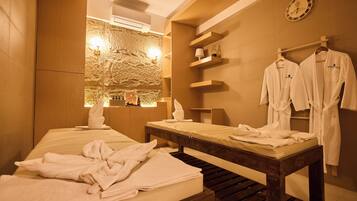 Relax in a serene space with a large bed, wooden bench, and wall-mounted shelf.