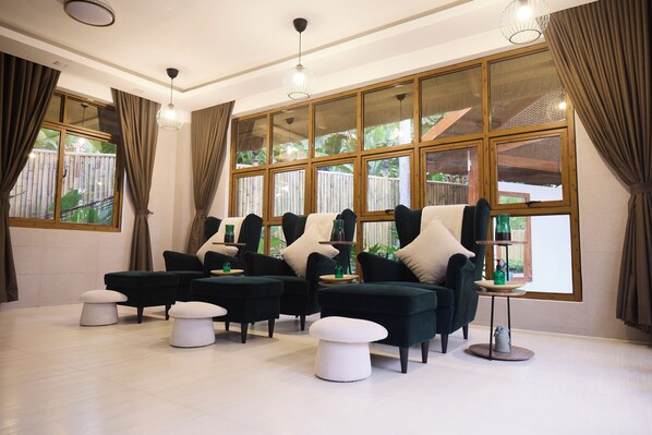 A room with a large window, multiple chairs, and a small table. - Casa Verde Cliff Resort and Spa (San Francisco)