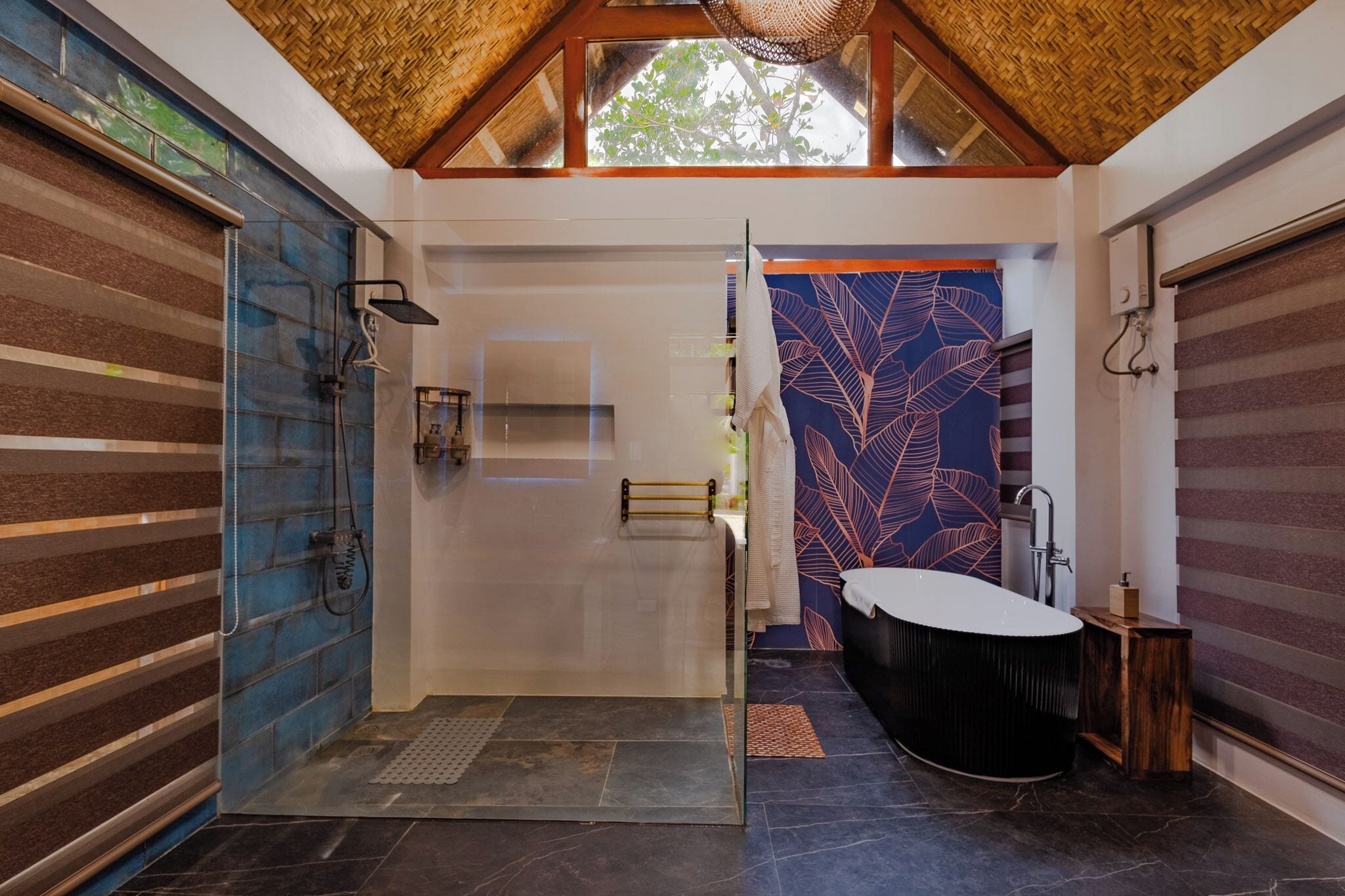 A modern bathroom with a shower, a bathtub, and a large window.