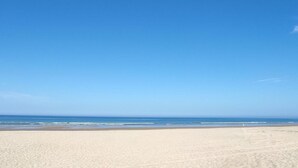 A beach with clear skies and calm water. - Balc n Atl Ntico 27786 (Conil de la Frontera)