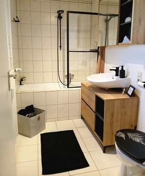 Shower, hair dryer, towels