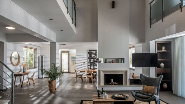 A spacious living room with a fireplace, a television, and a comfortable seating area. - Villa Ete: Prime 4BR Retreat with Private Pool (Stalida)