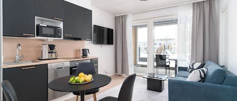 Family Apartment, Garden View | Desk, laptop workspace, blackout drapes, soundproofing