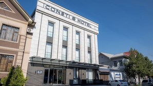 A CONTI HOTEL with a modern facade, large windows, and a visible entrance. - Consti Hotel Tashkent (Tashkent)