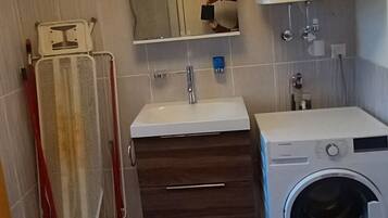 Shower, towels, soap, toilet paper