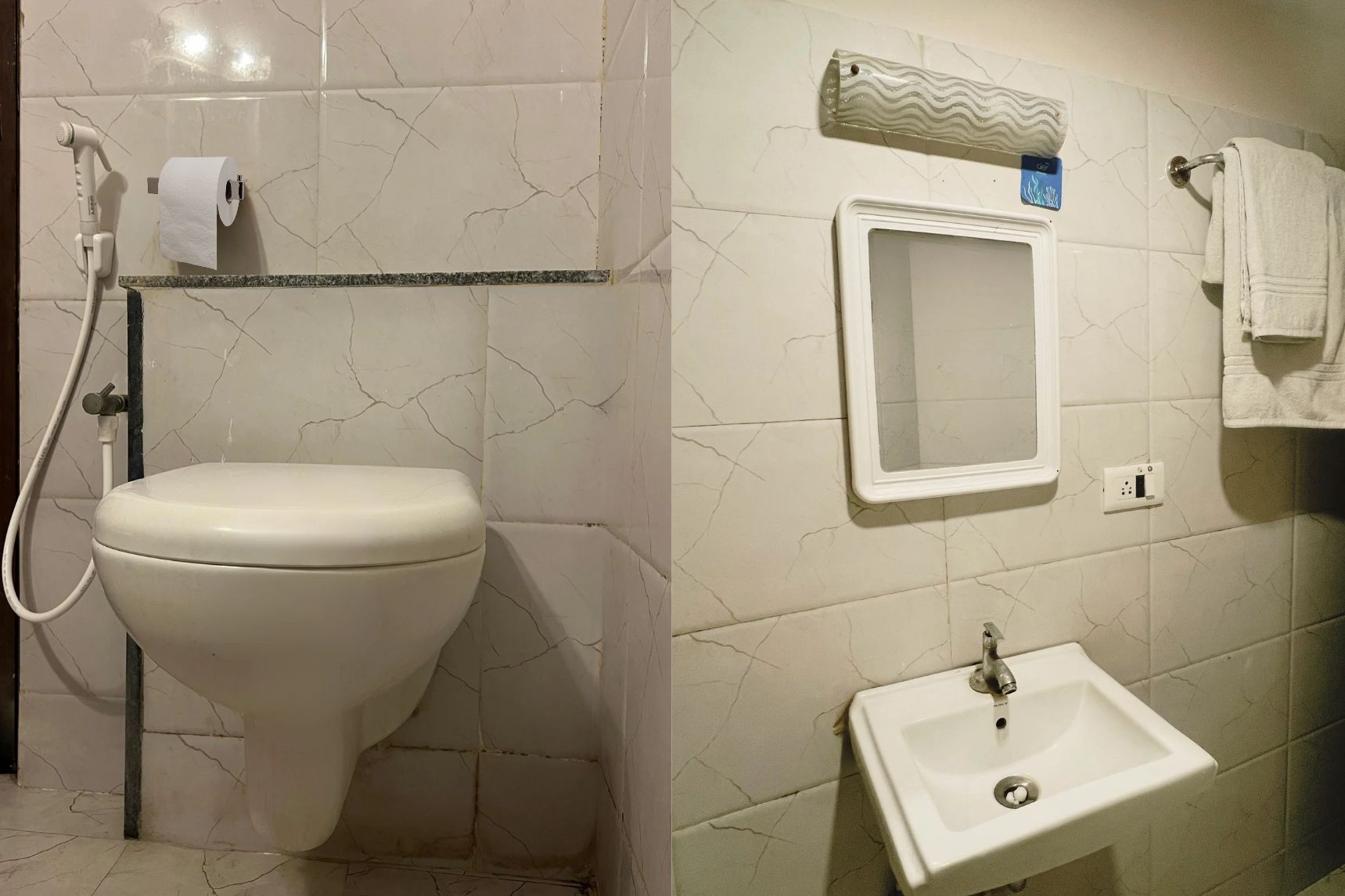Un baño con inodoro, lavabo y ducha.