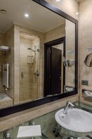 Combined shower/tub, free toiletries, bathrobes, slippers