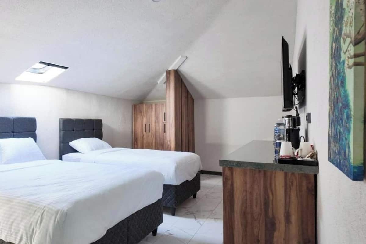 Premium bedding, minibar (free items), desk, laptop workspace