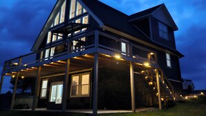 A large two-story house with a balcony and a covered porch area. - Black Diamond-New Build, Ski, Hot Tub,  Views, BBQ, EV & AC (Davis)