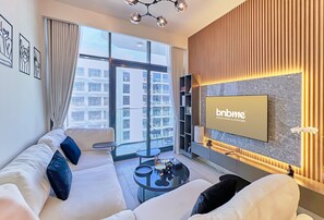 Appartement Premium, 1 grand lit, balcon, vue piscine | Salle de séjour