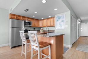 Fridge, microwave, oven, stovetop - Garden City Beach Oceanfront Condo 1005 | Rising Tides Properties Rental (Murrells Inlet)