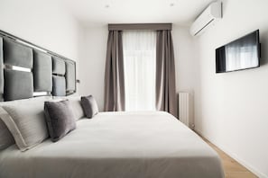 Apartamento premier, 1 quarto | 1 quarto, cofres nos quartos, individualmente decorados