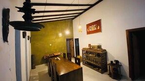 A traditional Japanese-style room with tatami flooring, a low wooden table, and a hanging light fixture. - 2-bedroom house in nice Pilimathalwa with WiFi, AC (Pilimathalwa)