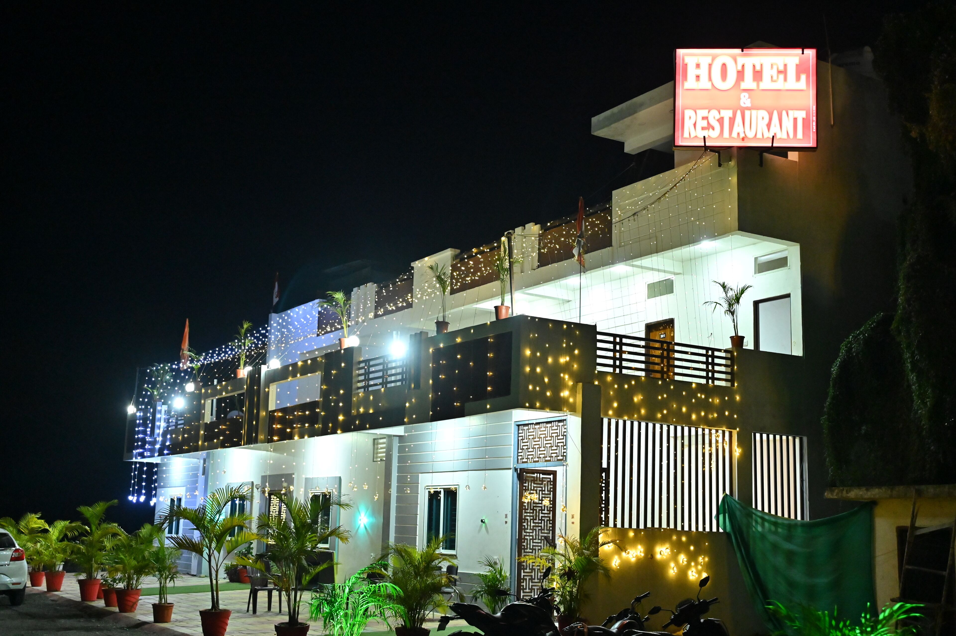 A multi-story hotel with a prominent sign indicating it is a hotel and restaurant.
