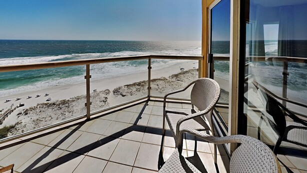 A balcony with a view of the beach and ocean. - Emerald Isle | Corner Condo w. Pool/Hot Tub, Private Beach + More (Pensacola Beach)