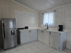 Fridge, coffee/tea maker, electric kettle, toaster