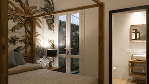 A bedroom with a bed, a nightstand, a lamp, and a window with a view of trees. - La Maison Coloniale Suites (The Saigon Jade) and Wellness Zone (Cagliari)