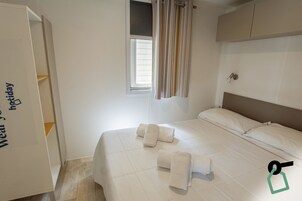 2 habitaciones, caja de seguridad en la habitación y ropa de cama 