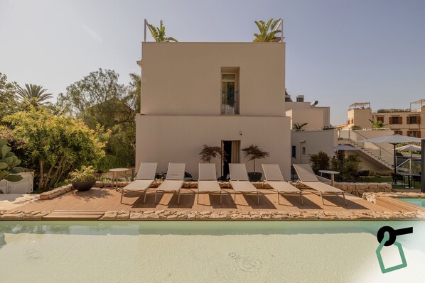 Outdoor pool, open 9:00 AM to 6:00 PM, pool umbrellas, pool loungers