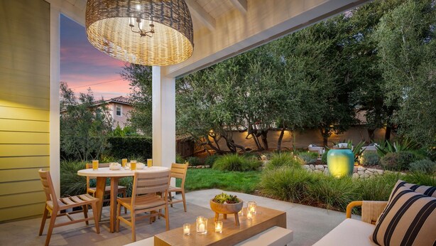 An outdoor patio with a round table, chairs, a bench, and a sofa. - Lighthouse Dreams - Mesa Stunner Near the Beach (Santa Barbara)