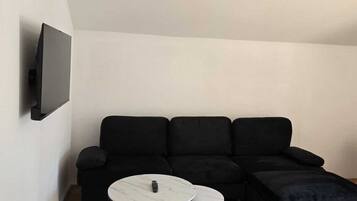Family Apartment | Living area | Flat-screen TV