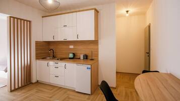 Comfort Apartment, Balcony, Garden View | Living area | Flat-screen TV