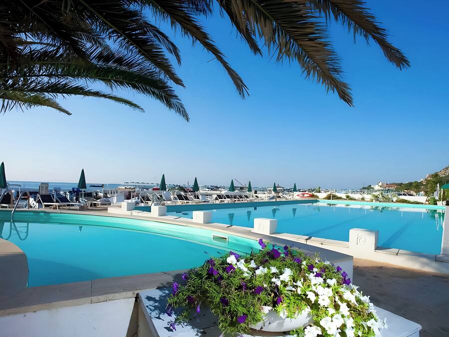 Seasonal outdoor pool, open 9:00 AM to 7:00 PM, pool umbrellas