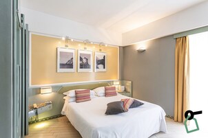 Triple Room, Balcony | Minibar, in-room safe, desk, free WiFi