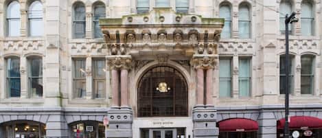 A historic building with ornate architectural details, including columns and decorative moldings.