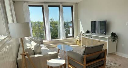 Sunny downtown Belfast apartment with water view, right on Main St near eateries