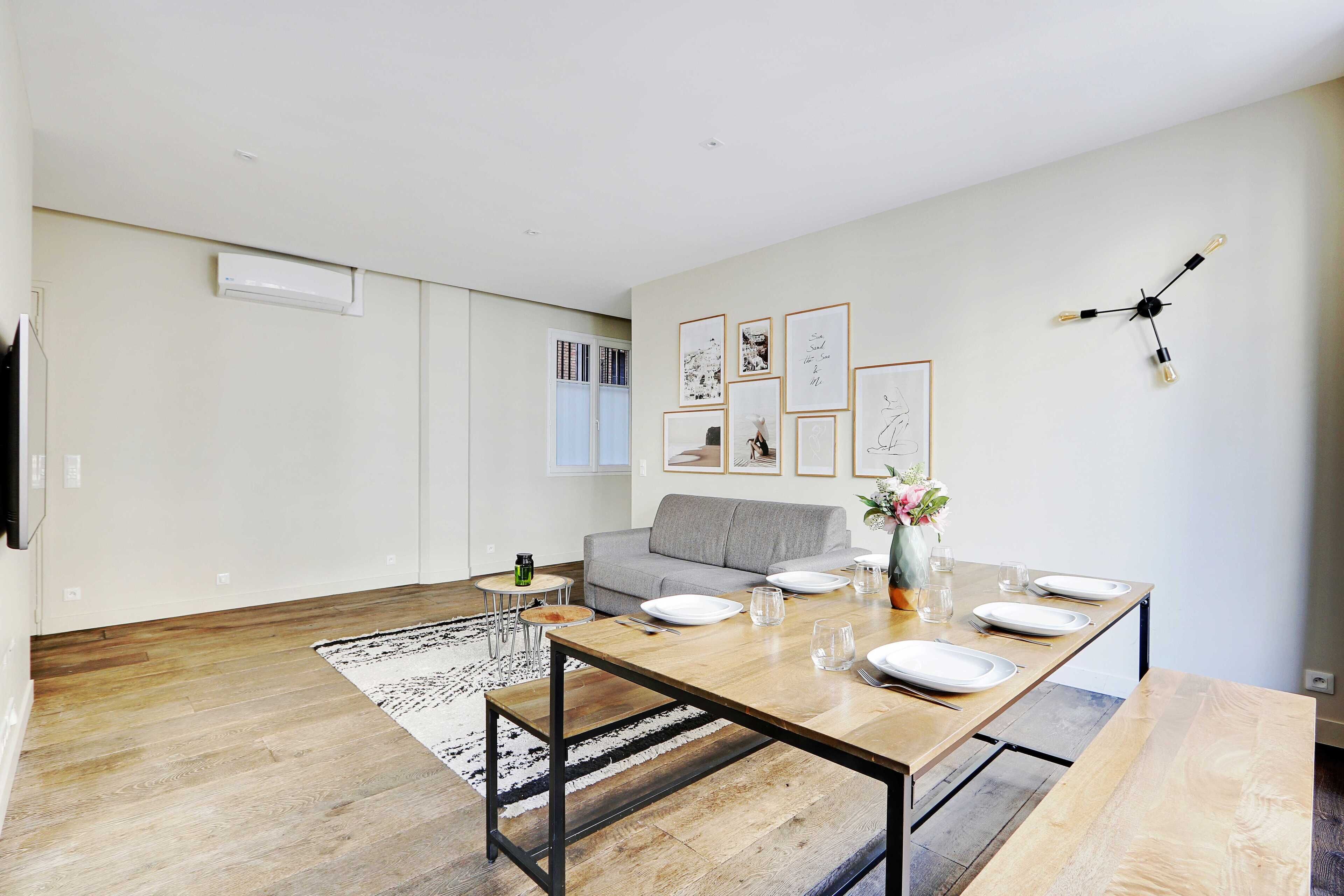 Comfort Apartment | Living area | 55-inch flat-screen TV with cable channels