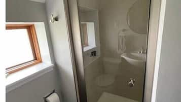 Shower, towels, soap, toilet paper