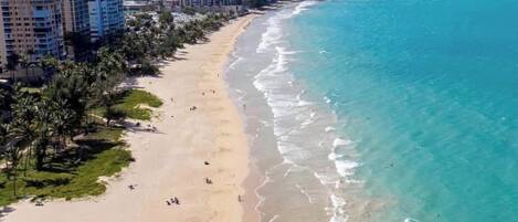 On the beach, sun loungers, beach towels